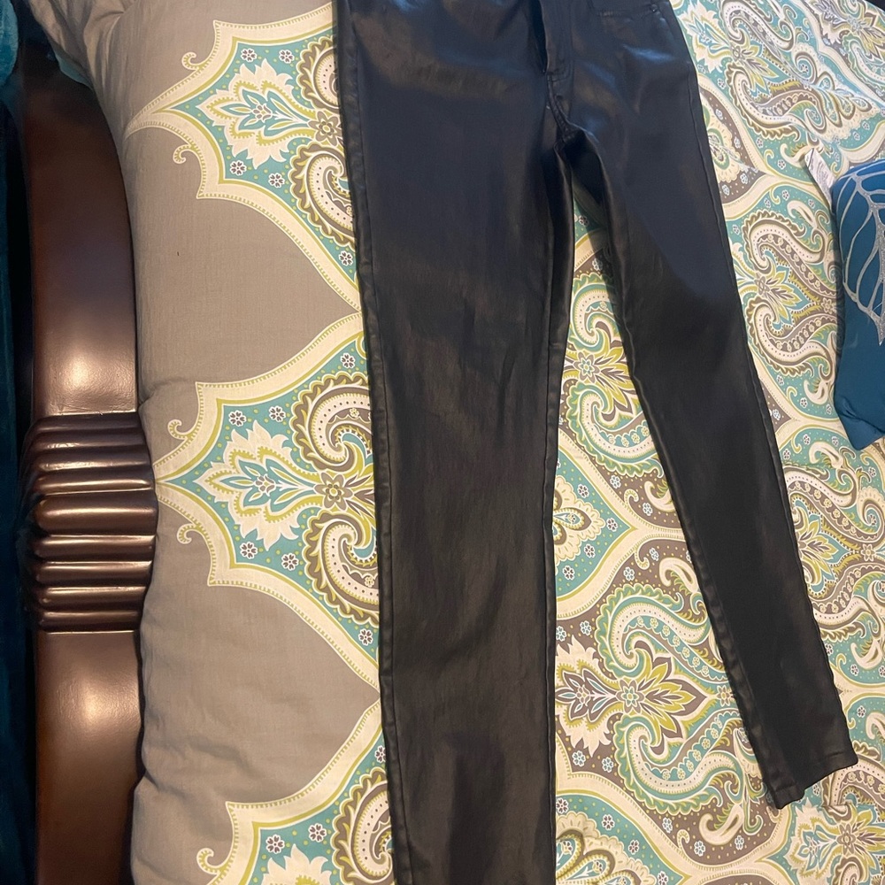 Used black leather jeans size 6 .